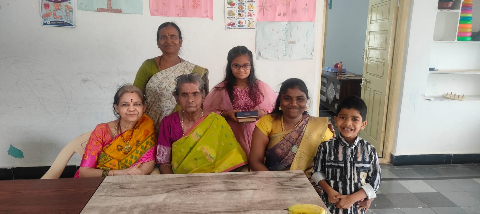 Family visit at the special school, trustees with a family