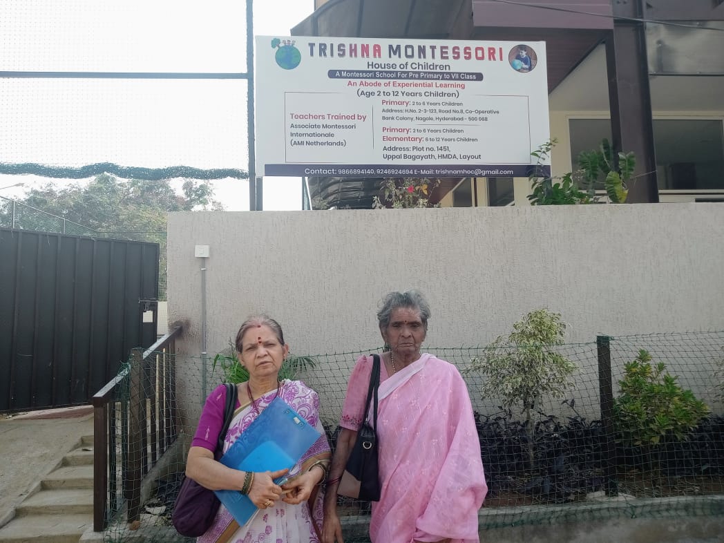 Trustees outside Trishna Montessori, House of Children, Nagole