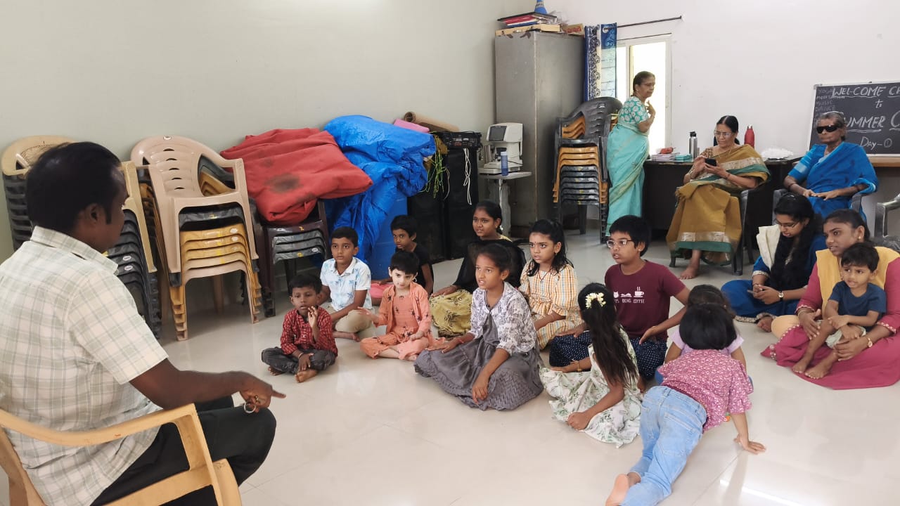 Summer camp Day 1, children seated for a session